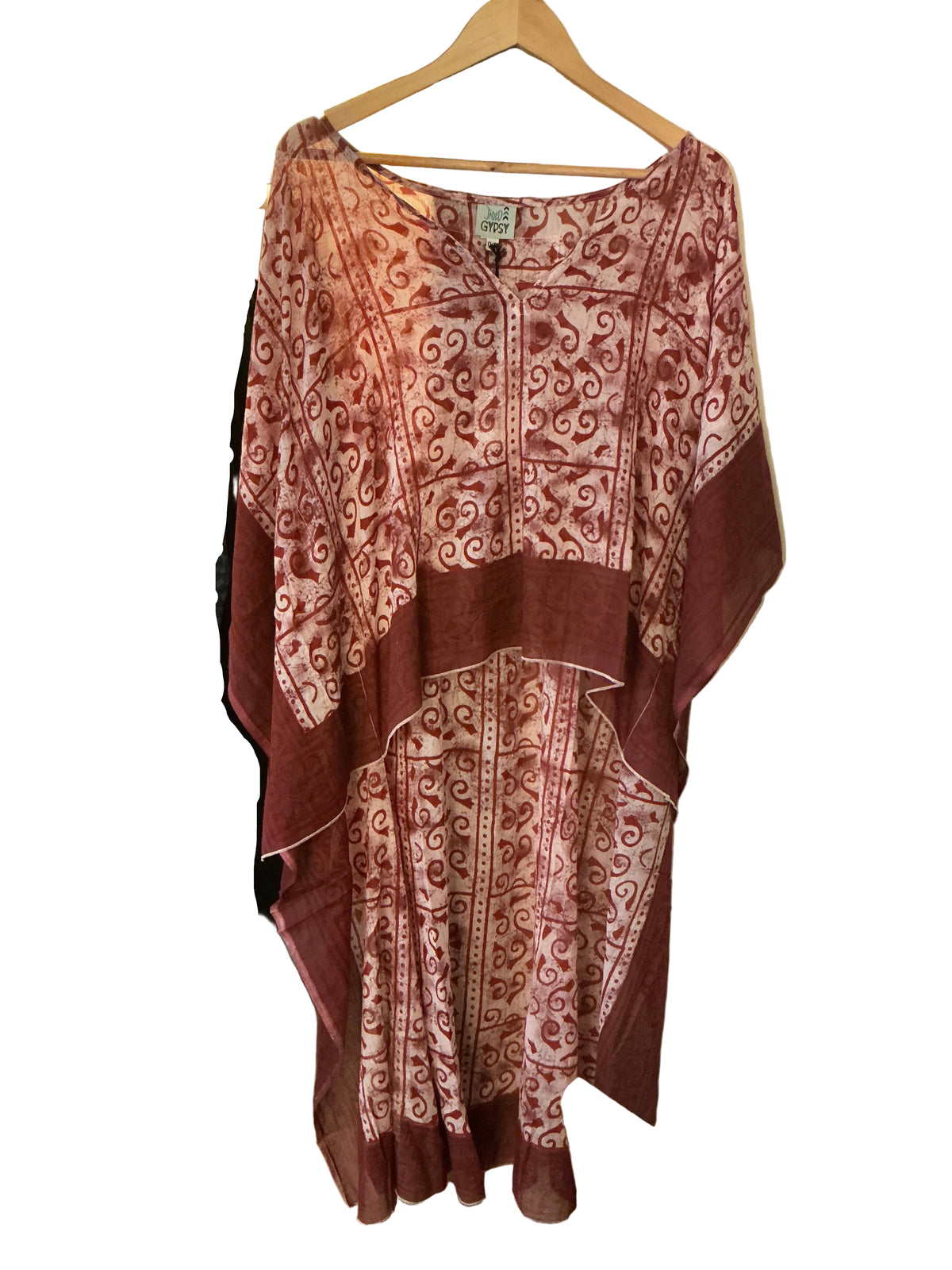 Red batik tunic on hanger